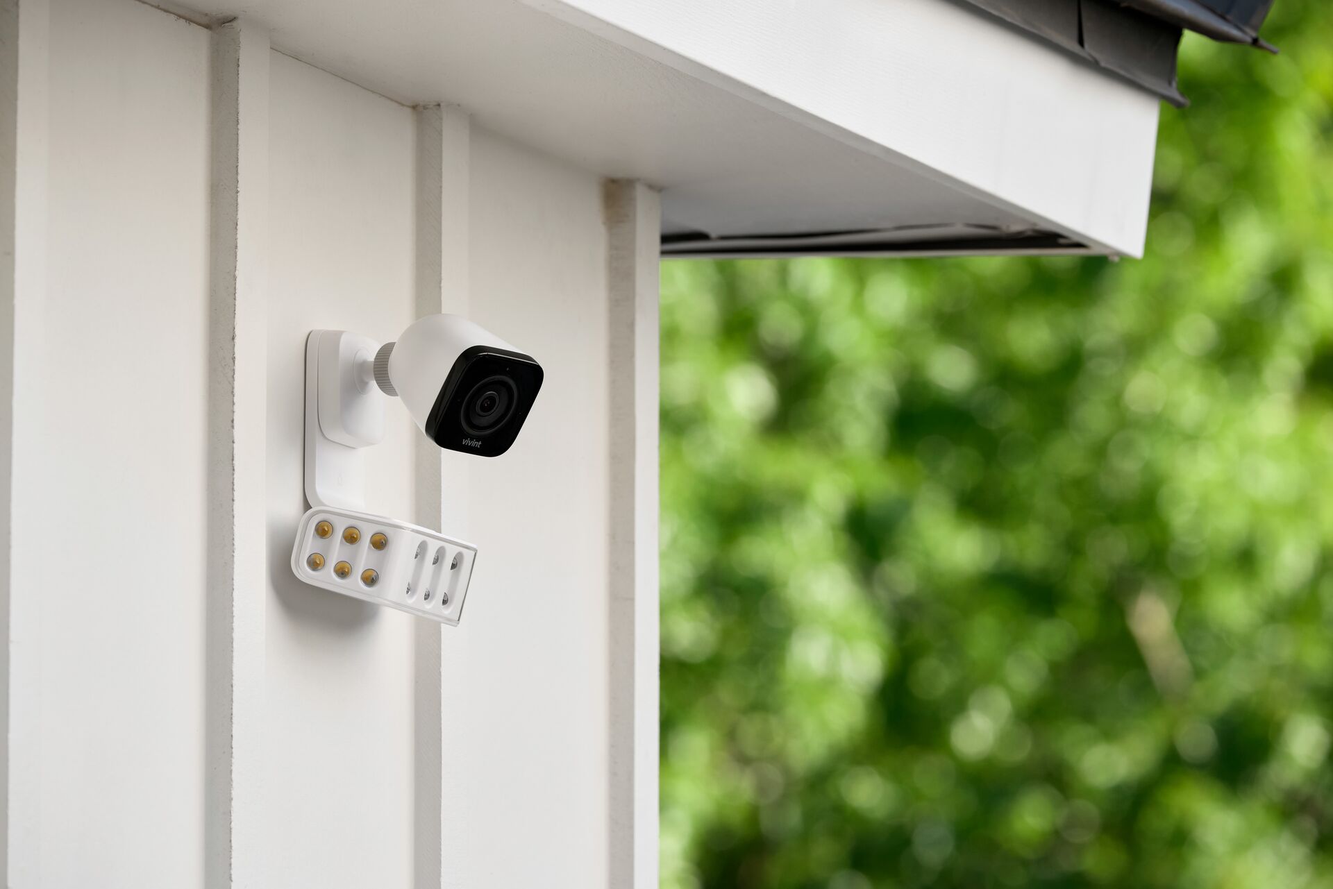 Weatherproof indoor outdoor wall mounted smart camera with articulated swivel mount