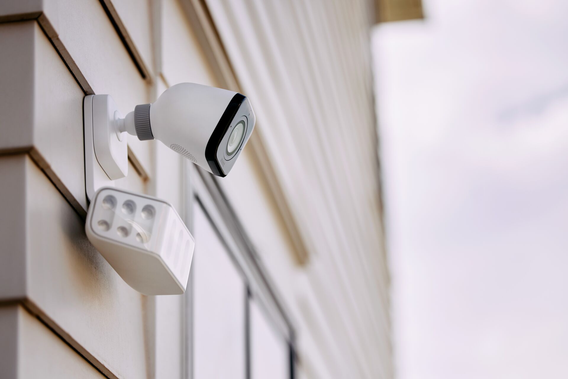 Outdoor spotlight security camera with high output dual LED illumination beams
